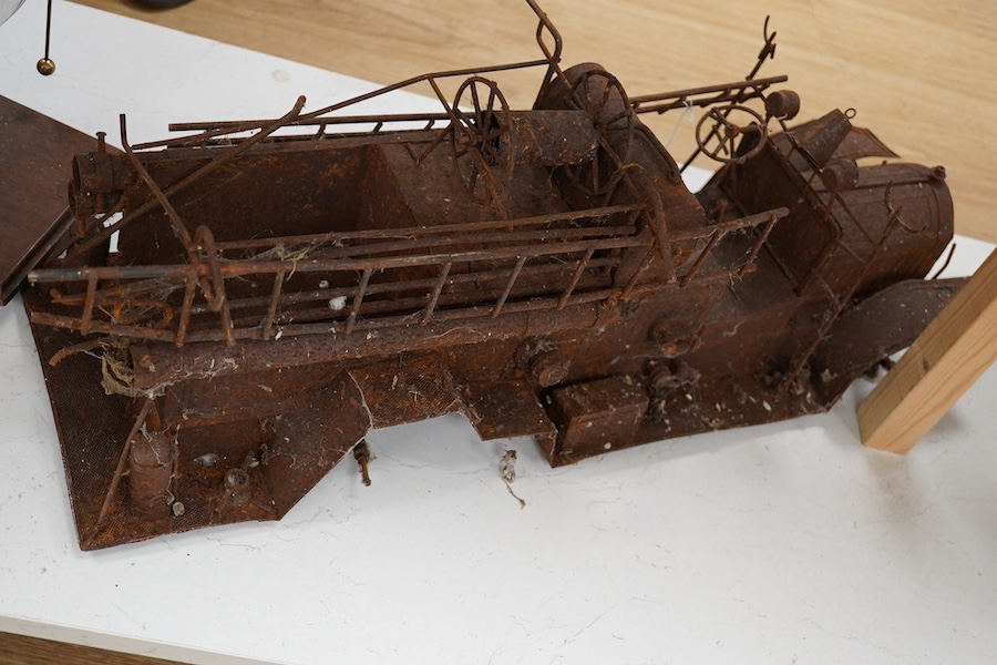 A skeleton of a toy vehicle 80cm long. Condition - rusty, without wheels